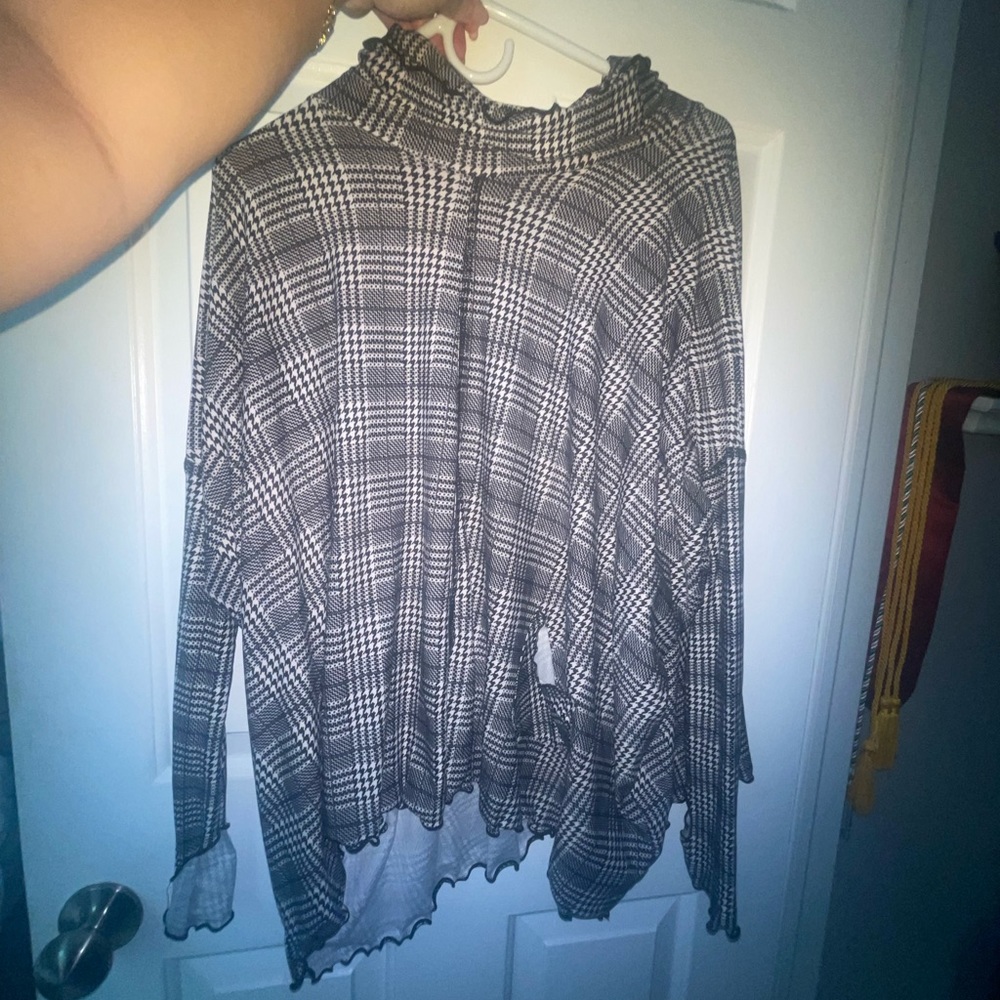 Worn twice has an open back pockets on the front